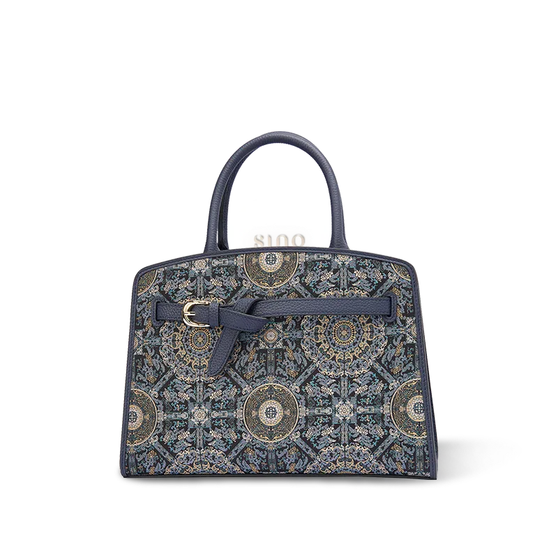 Luxury Song Brocade Bada Yun motif leather top handle bag with navy leather trim front view.