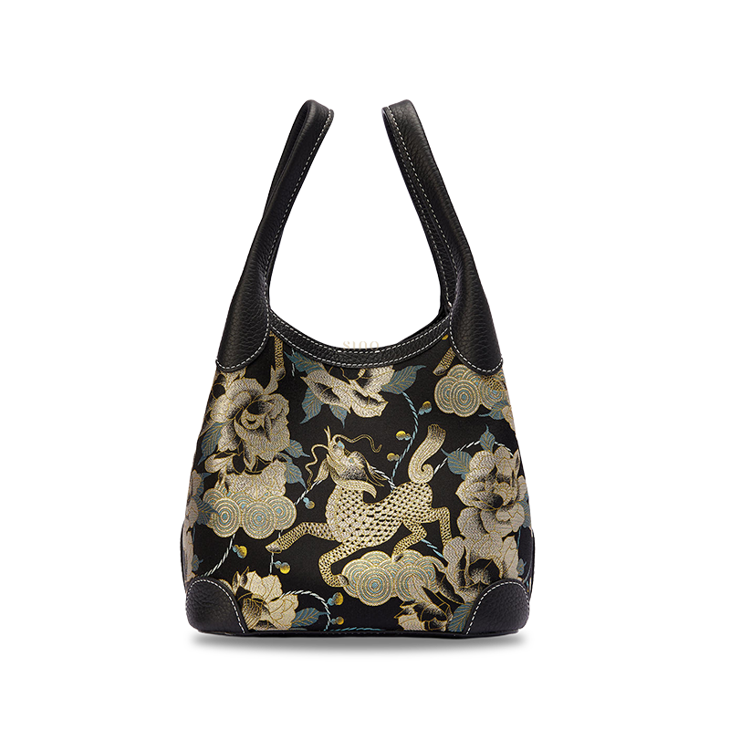 Front view of luxury Song Brocade black gold Qilin peony leather basket tote bag, showcasing intricate Qilin and peony woven pattern with premium craftsmanship.