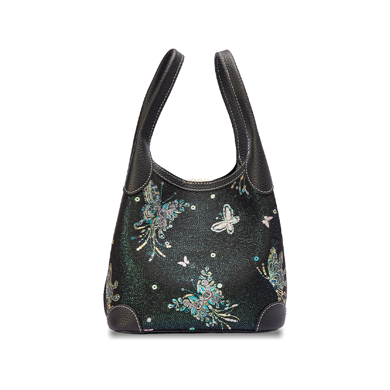 Front view of the Luxury Song Brocade Butterfly & Pearl Leather Basket Tote Bag, featuring a black brocade body with butterfly motifs and pearl-inspired accents.