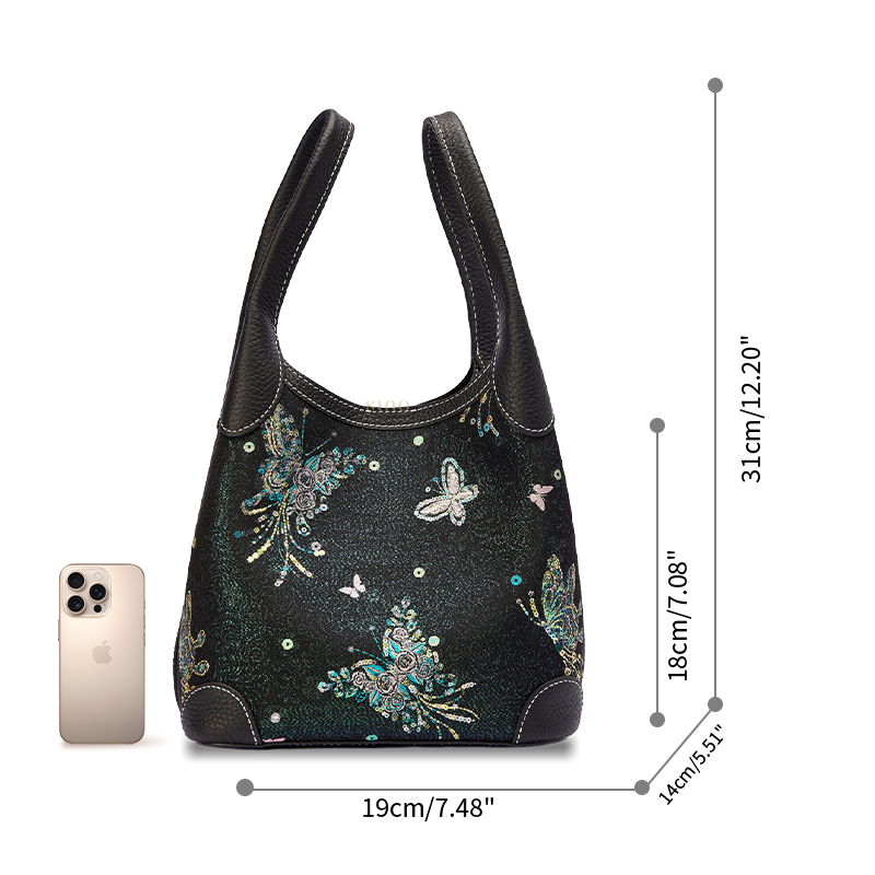 Size reference image of the Luxury Song Brocade Butterfly & Pearl Leather Basket Tote Bag, shown with a phone for scale and everyday carrying capacity.