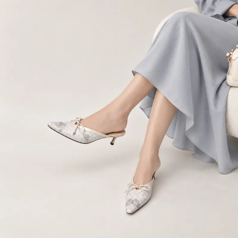 Luxury Song Brocade Butterfly Reverie kitten heel mules for women styled with an elegant outfit, featuring Chinese-inspired silk brocade craftsmanship.