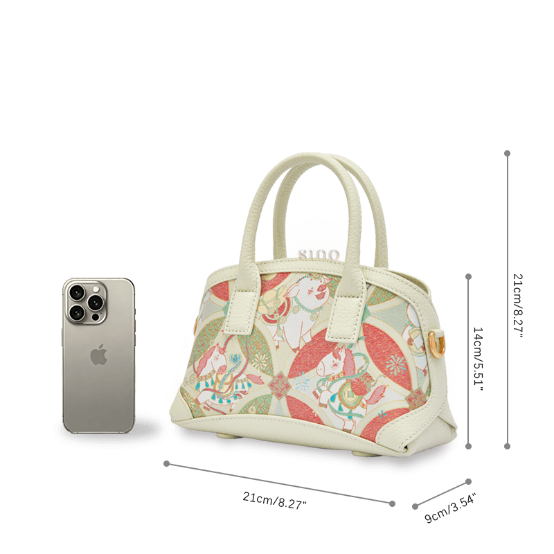 Model wearing the Luxury Song Brocade Enduring Prosperity Leather Top Handle Bag with detachable shoulder strap.