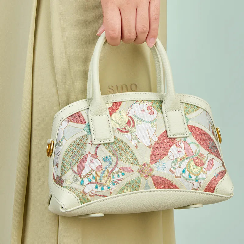 Interior, back, base, and side views of the Luxury Song Brocade Enduring Prosperity Leather Top Handle Bag.