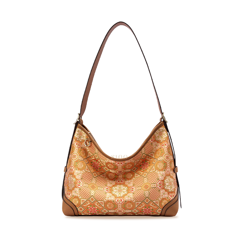 Front view of the Luxury Song Brocade Orange Peony Motif Leather Crossbody Bag, featuring an orange floral brocade pattern with brown leather trim.