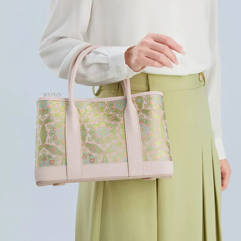 luxury-song-brocade-pink-baoxiang-floral-motif-tote-bag-model-side-hand-carry.