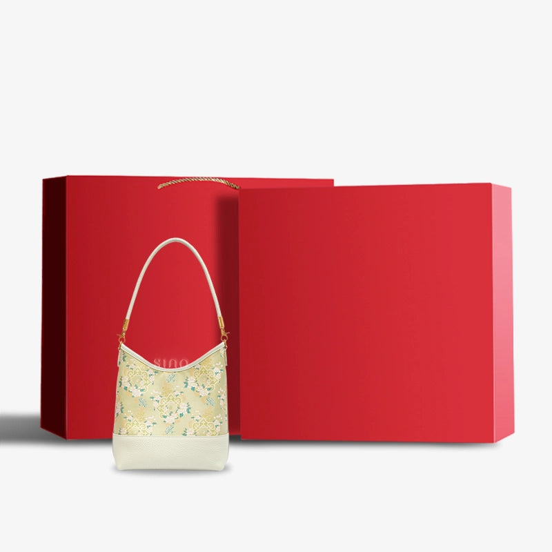 Luxury Ruyi Blossom Song Brocade shoulder bag displayed with an elegant red gift box.