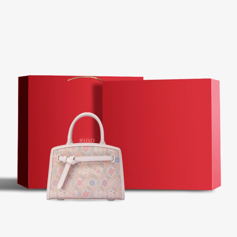 Luxury Song Brocade Ruyi Longevity Motif Leather Top Handle Bag displayed with premium gift box packaging.