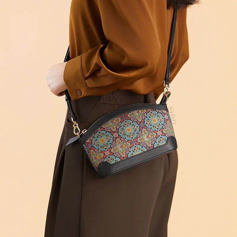 Model wearing the Luxury Song Brocade Scrolling Foliage & Lotus Motif Clutch Bag crossbody at the waist, side view.