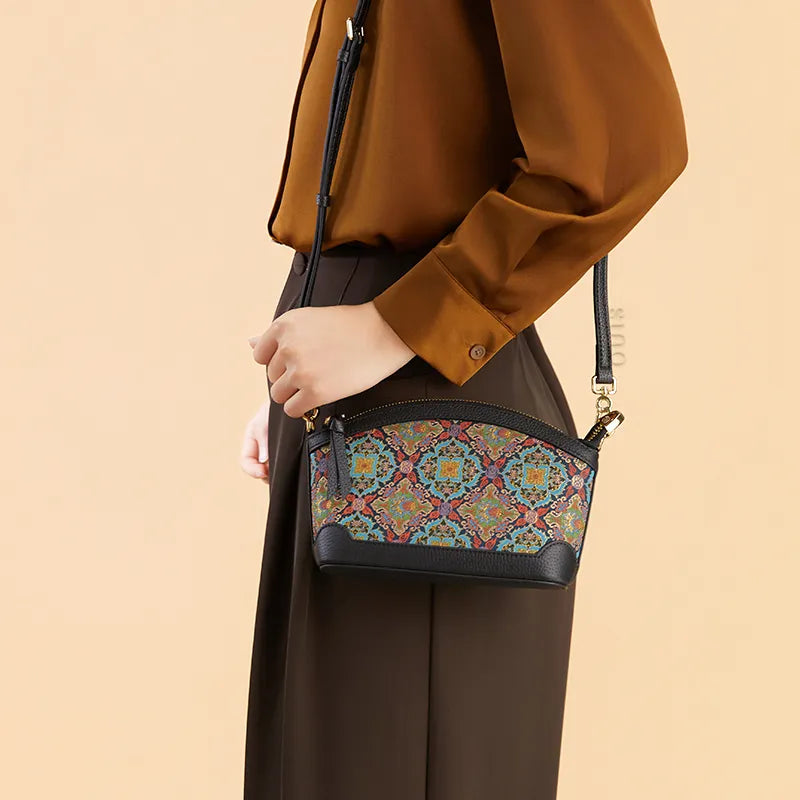 Model wearing the Luxury Song Brocade Scrolling Foliage & Lotus Motif Clutch Bag as a shoulder bag, side view.