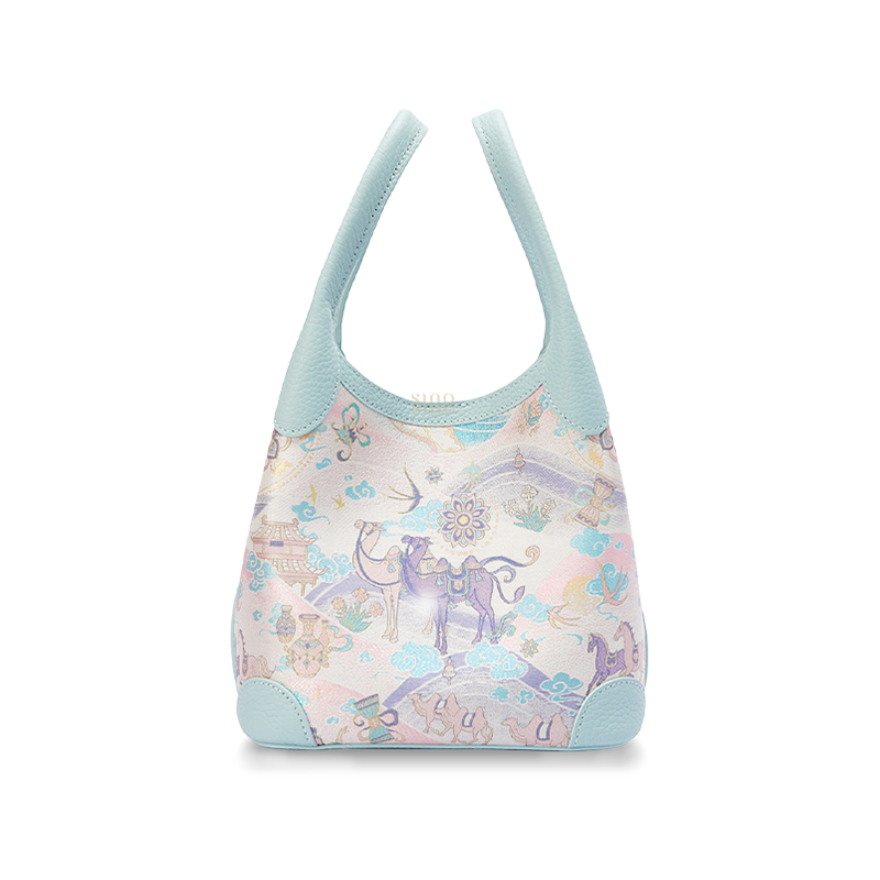 Front view of the Chinoiserie Luxury Song Brocade Silk Road Leather Basket Tote Bag, featuring a pastel Silk Road motif with camel, horse, cloud, and floral elements.