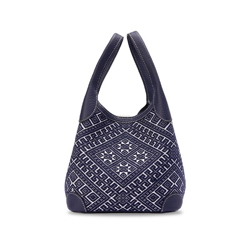 Chinoiserie luxury Zhuang brocade Flying Swallow leather basket tote bag front view on white background, showcasing intricate woven geometric brocade pattern and structured basket silhouette.