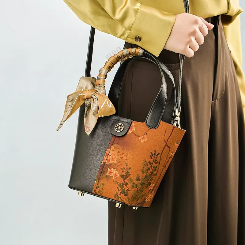 Model wearing Xiangyunsha silk bag on shoulder.
