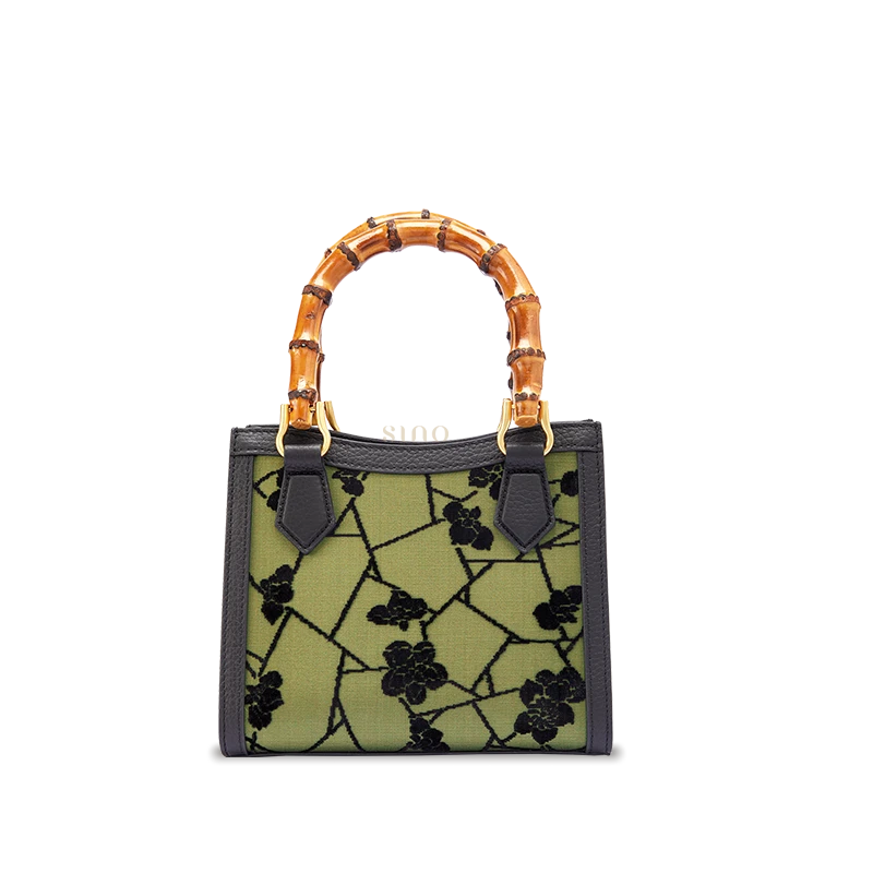 Mulberry silk Cracked Ice Plum Blossom motif leather bamboo handle handbag featuring traditional Chinese Zhangrong Silk Velvet craftsmanship.