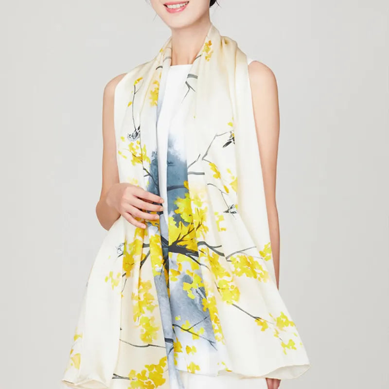 100% Mulberry Silk Long Scarf with Autumn Ginkgo - Model holding draped shawl over shoulders.