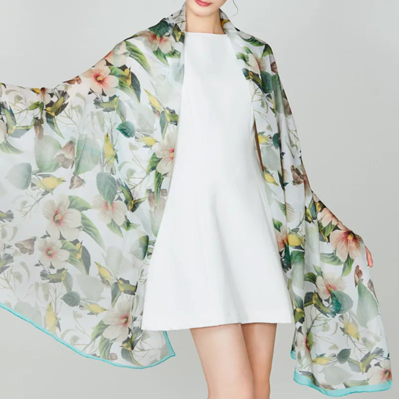 100% Mulberry Silk Long Scarf with Hibiscus & Avian - Model draping scarf over shoulders and arms.