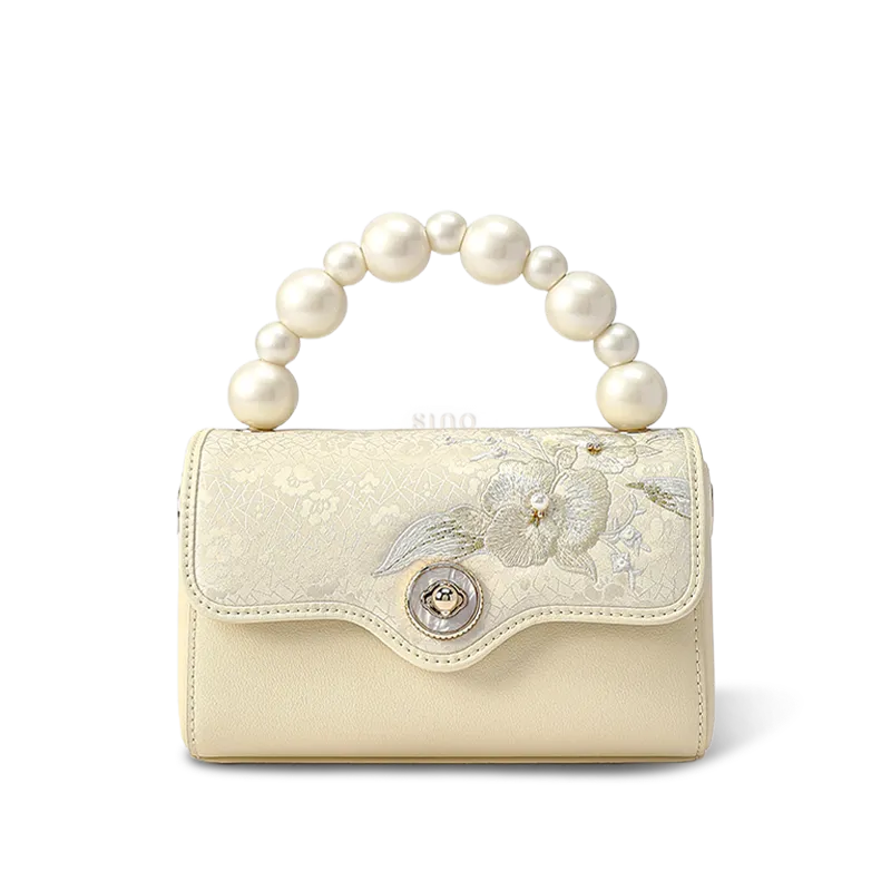 Front view: Orchid butterfly embroidered silk handbag.