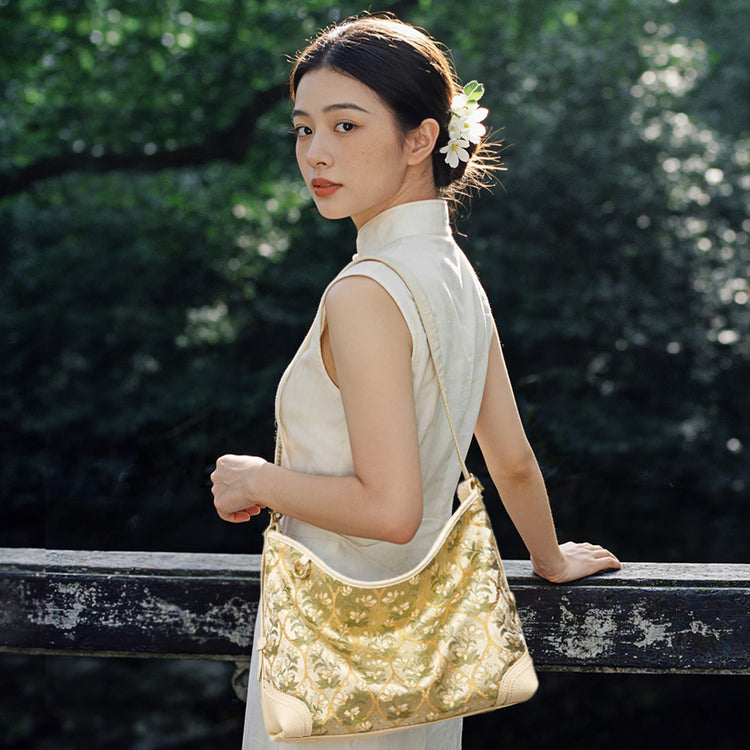 Chinoiserie Luxury Dayun Brocade Verdant Floral Leather Crossbody Bag on model, showcasing luxury Chinese embroidery handbag, perfect for elegant daily fashion and gift for women.