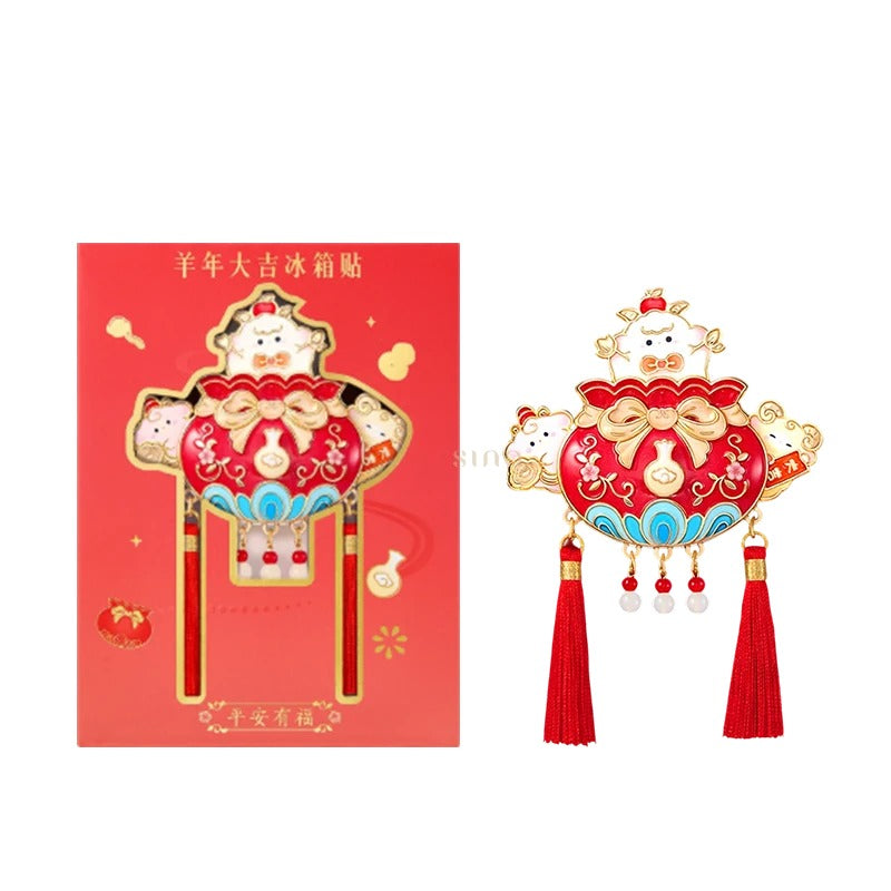 Red and gold Year of the Goat fridge magnet with matching red packaging, featuring sheep characters, lucky pouch motifs, and decorative tassels.