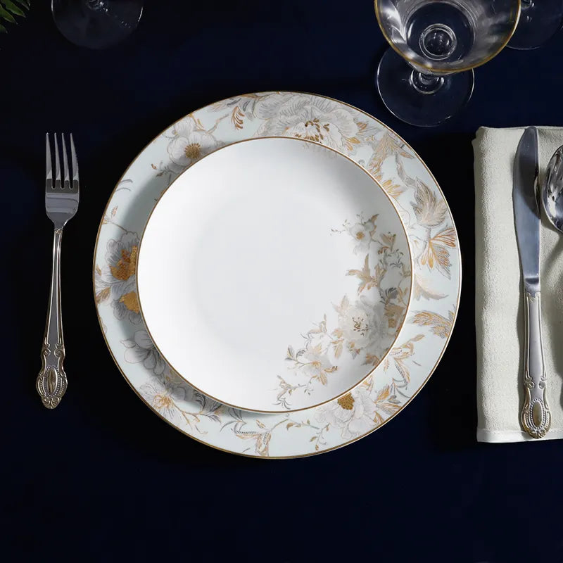 Overhead dining setting: Chinoiserie Bone China Plate with cutlery and wine glass.