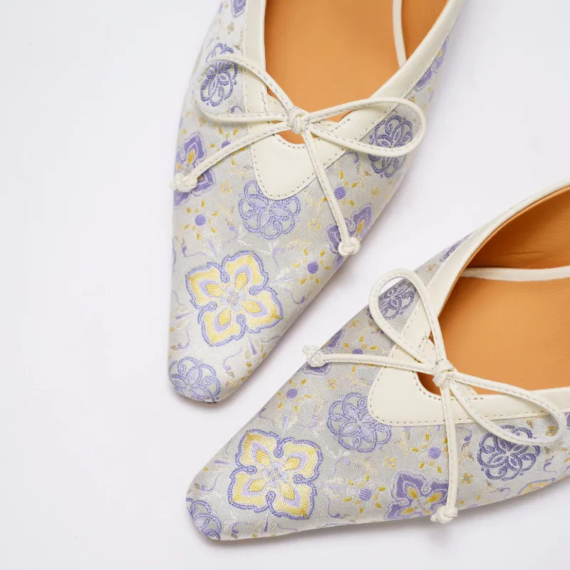Close-up detail of Ruyi Fortune motif on traditional Shu Brocade kitten heel mules.