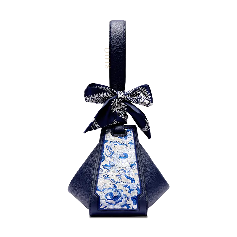 Blue leather handbag transformed into an original Zongzi shape with a SANLAN embroidered blue floral panel.