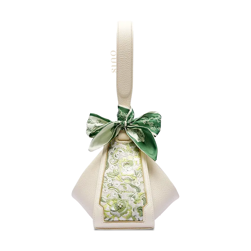 Beige leather handbag transformed into a Zongzi shape with a green SANLAN embroidered floral panel.