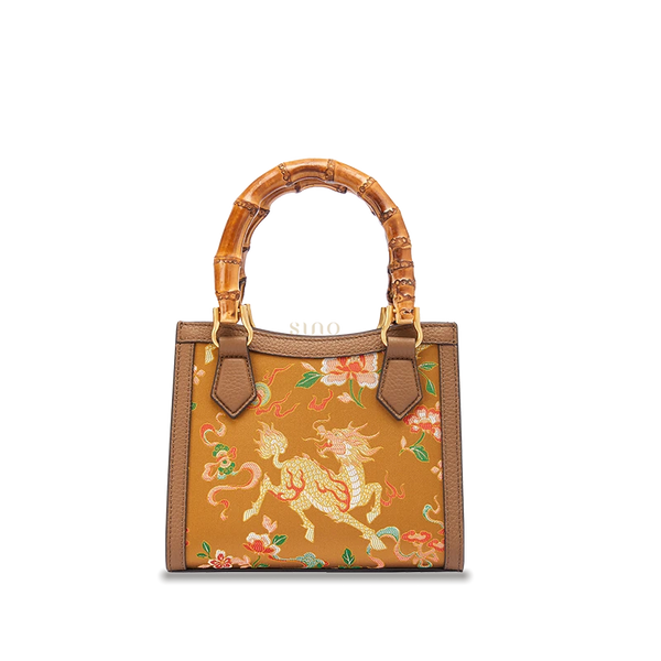 Shu Brocade Auspicious Qilin motif bamboo handle handbag crafted with silk brocade and leather details.