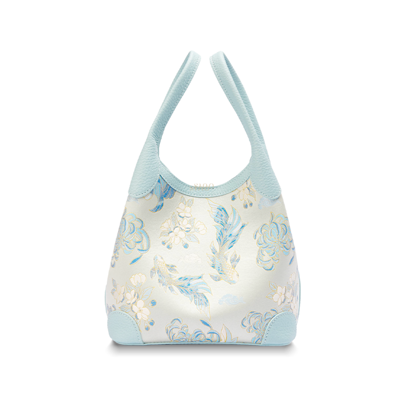 Front view of the Luxury Shu Brocade Golden Fish & Flower Leather Basket Tote Bag, featuring a light blue leather trim and delicate golden fish and floral brocade motif.