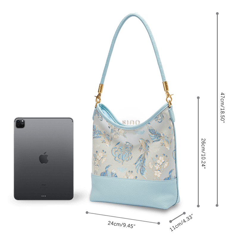 Size and capacity comparison of the Golden Jade Romance leather shoulder bag beside a tablet.