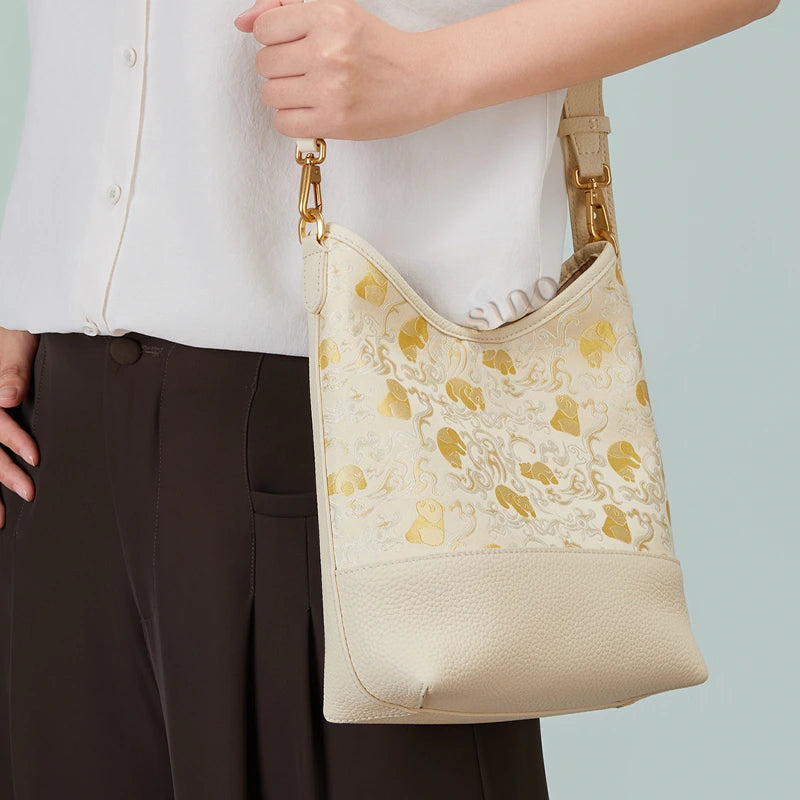 Model view of the Chinoiserie Luxury Shu Brocade Panda and Dragon Leather Shoulder Bag showing the adjustable strap and fit.