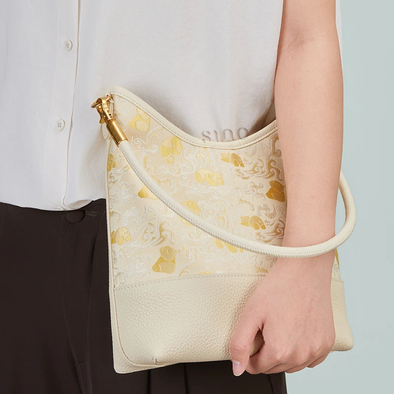 Model carrying the Chinoiserie Luxury Shu Brocade Panda and Dragon Leather Shoulder Bag in a close-up styling view.