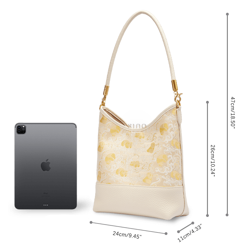 Size and capacity comparison of the Chinoiserie Luxury Shu Brocade Panda and Dragon Leather Shoulder Bag shown beside a tablet.