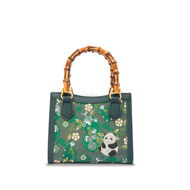 Shu Brocade Panda and Auspicious Gourd motif bamboo handle handbag crafted with silk brocade and leather details.