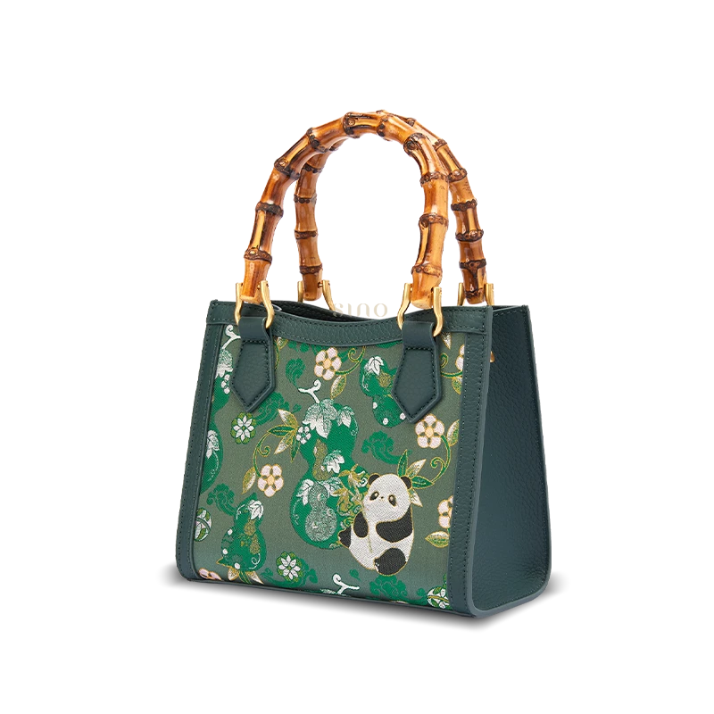 Front view of Shu Brocade Panda motif leather bamboo handle handbag featuring traditional Chinese textile design.