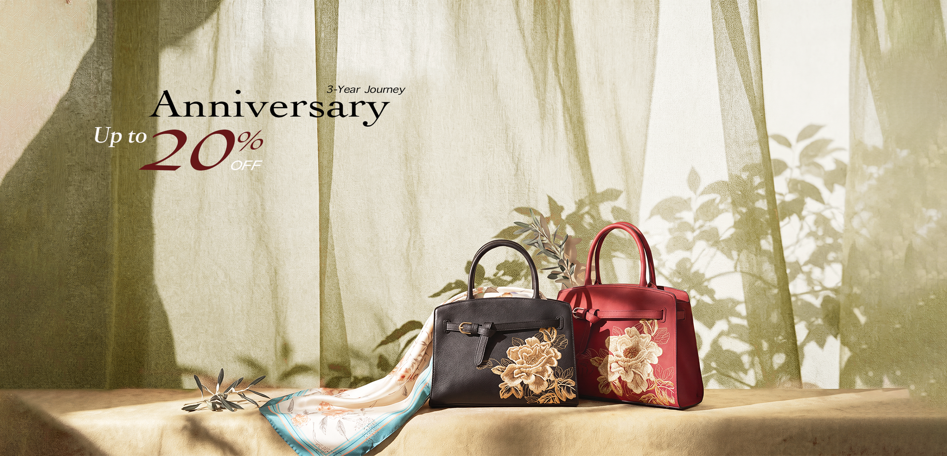 SinoCultural 3rd anniversary sale banner with embroidered handbags and a silk scarf, offering 15% off one item and 20% off two or more items.
