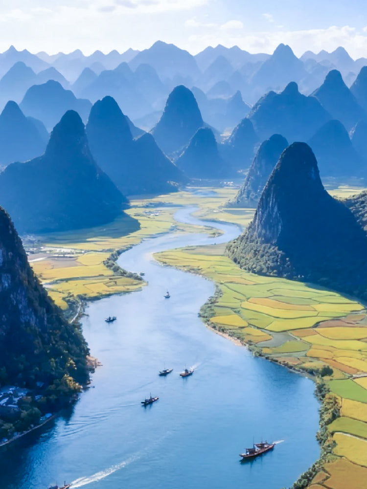SinoCultural Guilin Travel Guide 2026 cover featuring the Li River winding through dramatic karst mountains and rural fields in Guilin, Guangxi, China.