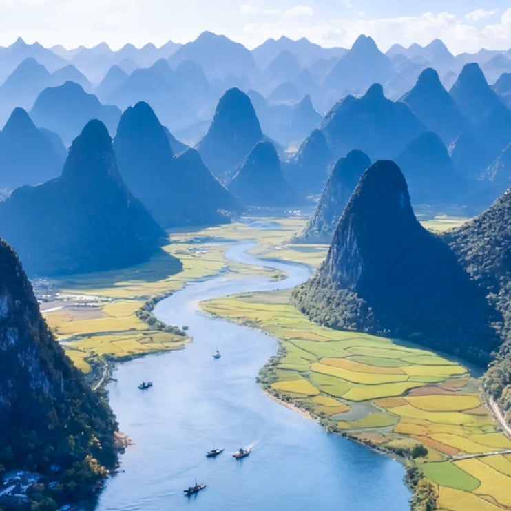 SinoCultural Guilin Travel Guide 2026 cover featuring the Li River winding through dramatic karst mountains and rural fields in Guilin, Guangxi, China.