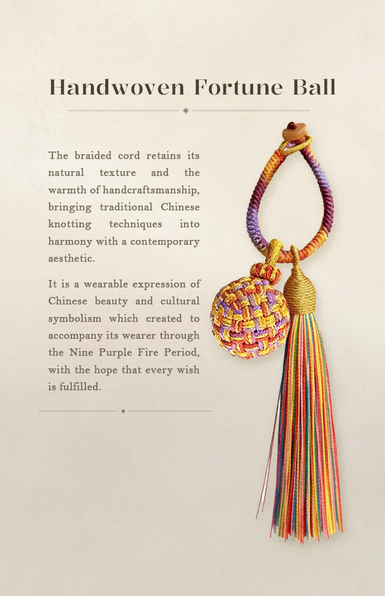 A handwoven Nine Purple Li Fire Fortune Ball Charm with a colorful braided tassel on a soft cream background.