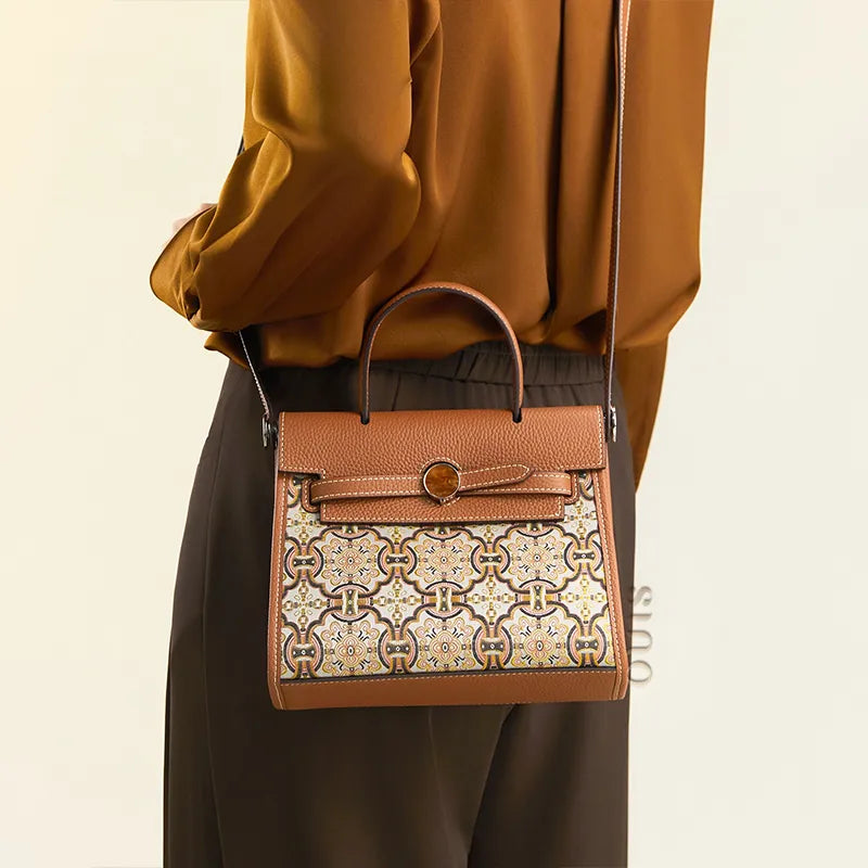 Model wearing the Song Brocade Auspicious Victory motif mini bag with a shoulder strap.