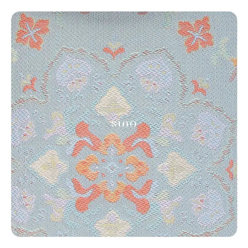 Close-up of the Baoxiang floral motif woven into Song Brocade on this Chinoiserie crossbody phone bag.