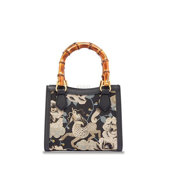 Song Brocade Black Gold Qilin Peony motif leather bamboo handle handbag featuring traditional Chinese textile craftsmanship.