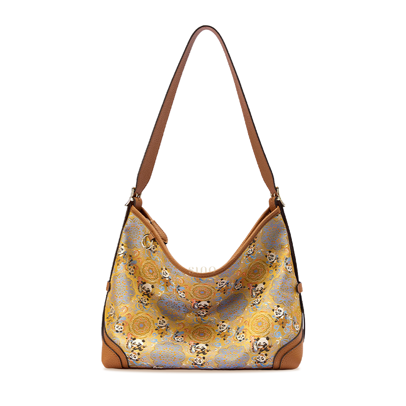 Front view of the Luxury Song Brocade Chang’an Court Dance Leather Crossbody Bag, featuring panda motifs, court dance elements, and brown leather trim.