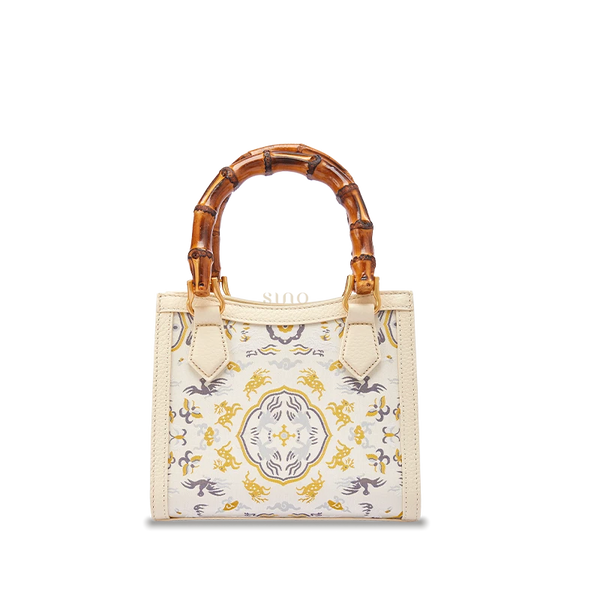 Song Brocade Deer & Crane in Spring leather bamboo handle handbag featuring traditional Chinese silk weaving and full-grain leather craftsmanship.