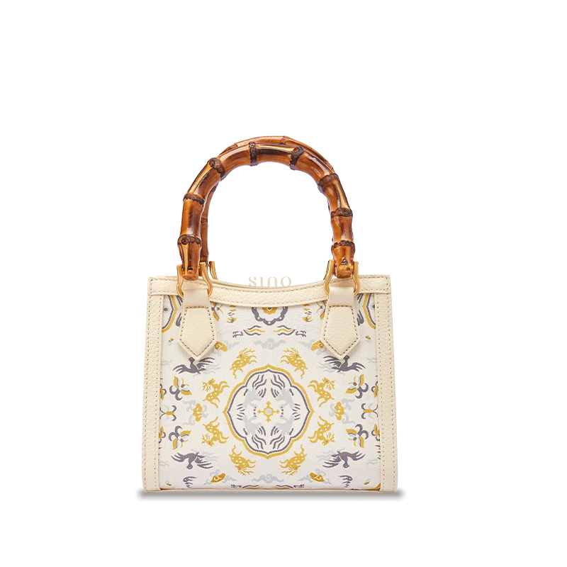 Song Brocade Deer & Crane in Spring leather bamboo handle handbag featuring traditional Chinese silk weaving and full-grain leather craftsmanship.