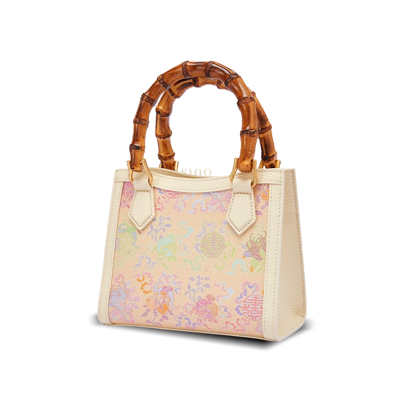 Front view of Song Brocade handbag featuring elegant Fortune and Longevity motifs woven into traditional silk brocade fabric.