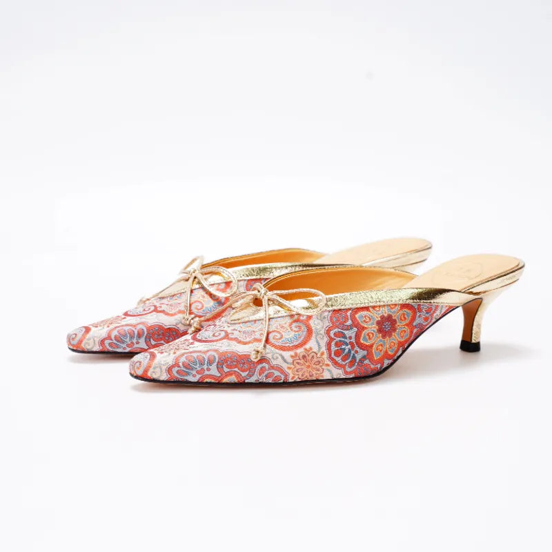 Side view of Luxury Song Brocade kitten heel mules with pointed toe and elegant low heel.