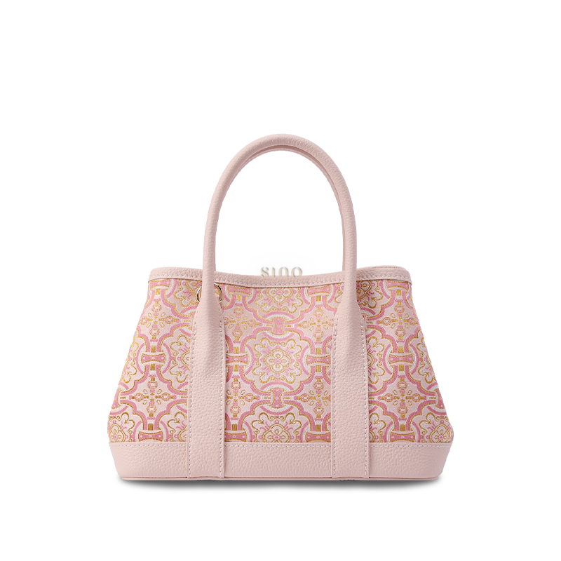 Front view of Song Brocade Pink DingSheng Motif Embroidered Leather Crossbody Bag showcasing auspicious embroidery on pink leather with adjustable strap.