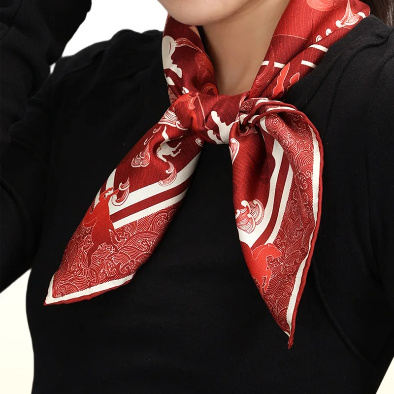 Woman wearing the Steed Across the Tides Mulberry Silk Square Scarf tied around the neck with a black outfit.