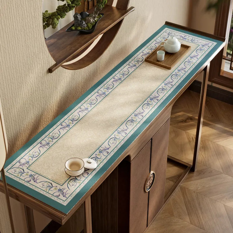 Summer blue leather cabinet top mat with floral border.