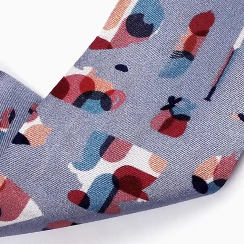 Close-up of colorful Suzhou Museum artifact silhouettes printed on 12 momme mulberry silk Twilly.